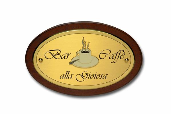 OVALE OTTONE 30x18 SU LEGNO